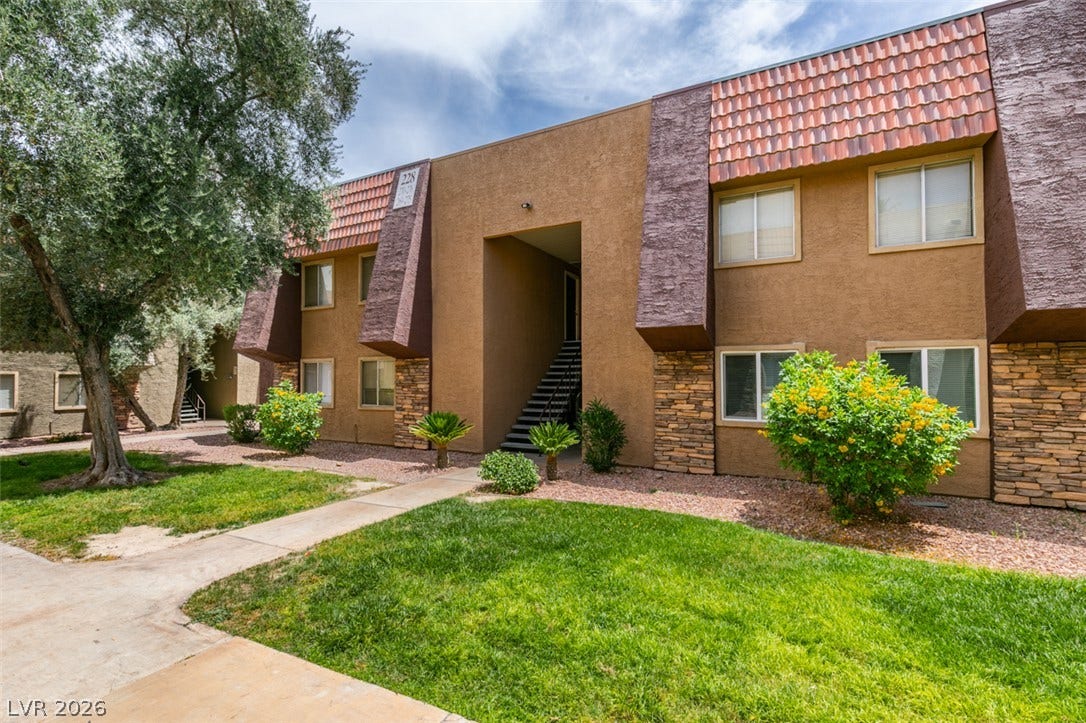 5240 Indian River Drive, #273, Las Vegas, NV 89103 Textured stucco and stone accents define the multi-level exterior of this residential building.