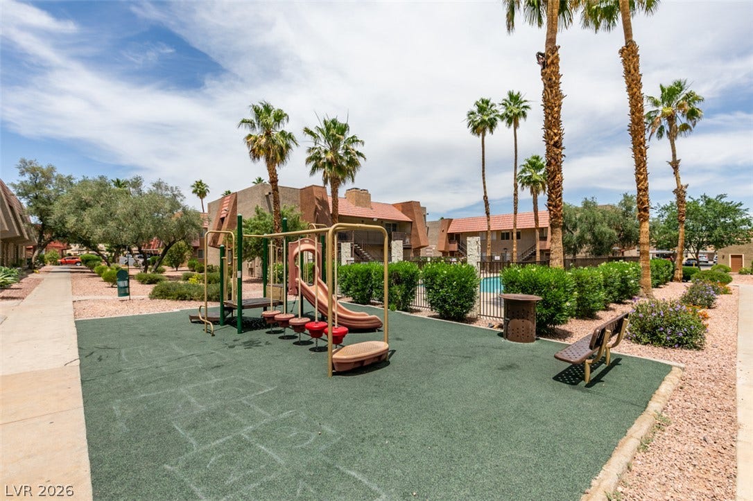5240 Indian River Drive, #273, Las Vegas, NV 89103 Towering palm trees frame the community playground adjacent to the sparkling swimming pool.
