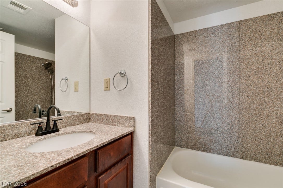 5240 Indian River Drive, #273, Las Vegas, NV 89103 Granite counters and matching tub surrounds bring enduring style to this functional bathroom.