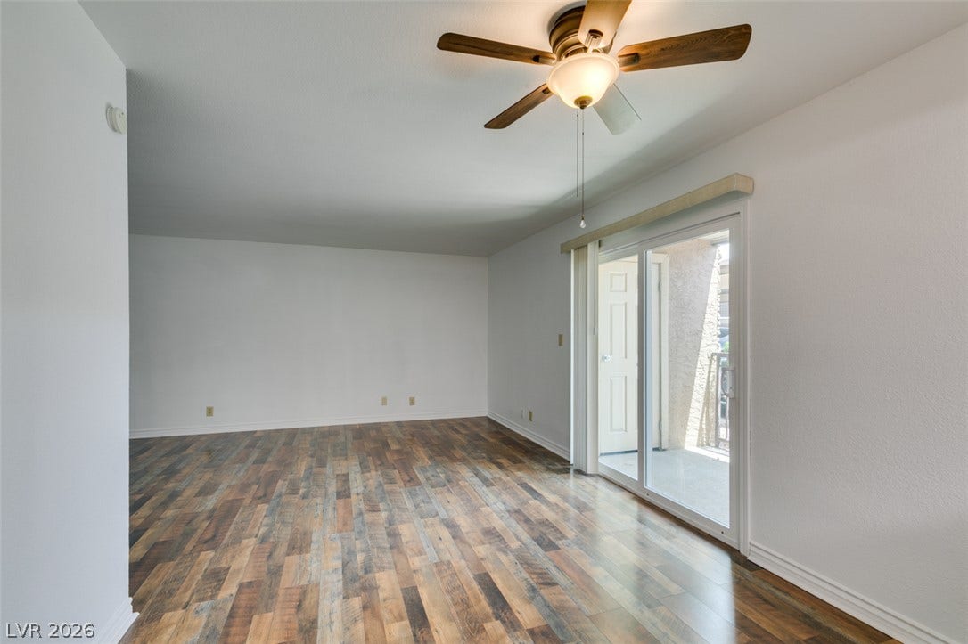 5240 Indian River Drive, #273, Las Vegas, NV 89103 Sliding glass doors open from the main living area onto a private balcony.