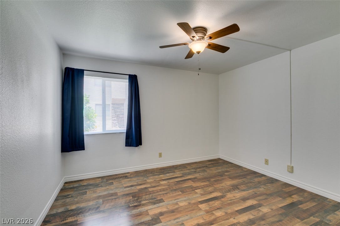5240 Indian River Drive, #273, Las Vegas, NV 89103 Rich wood-look flooring and a wide window bring warmth to this versatile space.