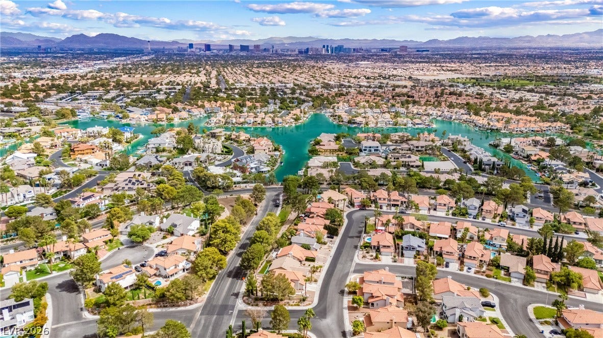 A sweeping panorama captures the vibrant neighborhood surrounding a scenic winding waterway.