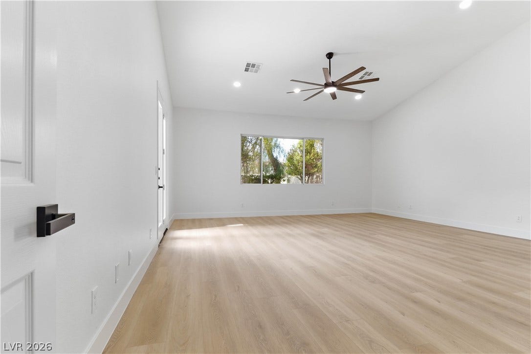 5150 Villa Dante Avenue, Las Vegas, NV 89141 Crisp white walls and clean-lined flooring define this versatile, airy interior space.