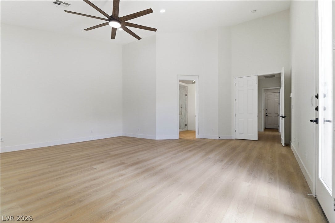 5150 Villa Dante Avenue, Las Vegas, NV 89141 Gleaming wood floors and towering high ceilings define this airy, open interior space.
