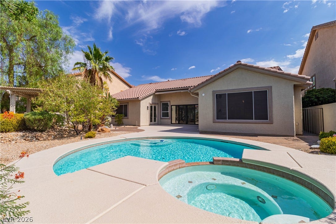5150 Villa Dante Avenue, Las Vegas, NV 89141 An inviting backyard oasis features a curved pool paired with an integrated spa.