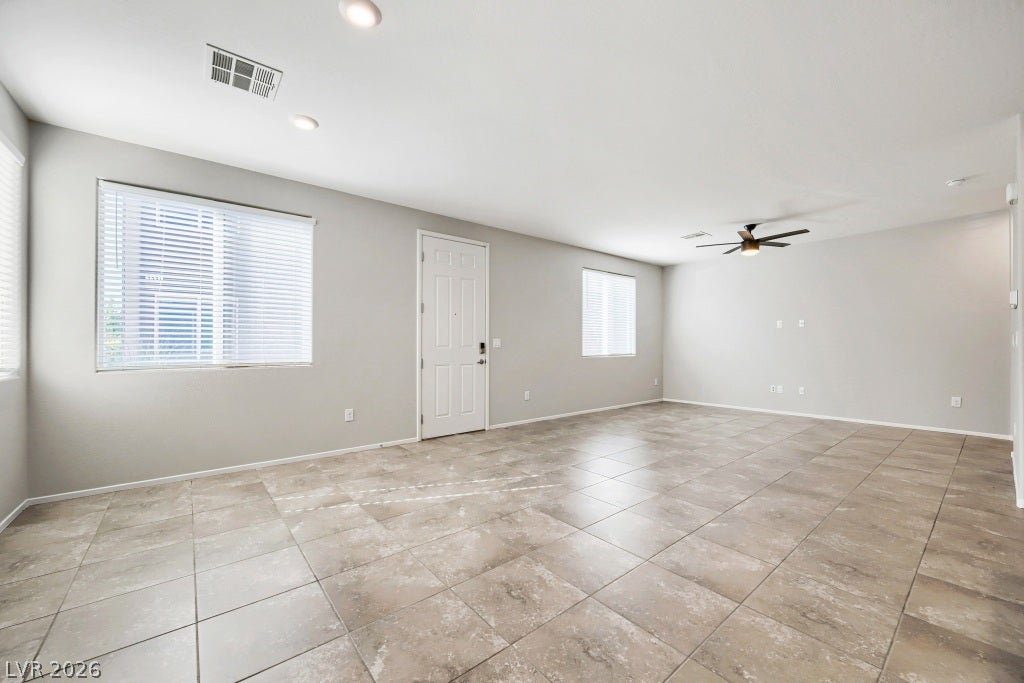 7241 Glistening Star Street, North Las Vegas, NV 89084 An open and versatile living space features durable tile flooring and plenty of natural light.