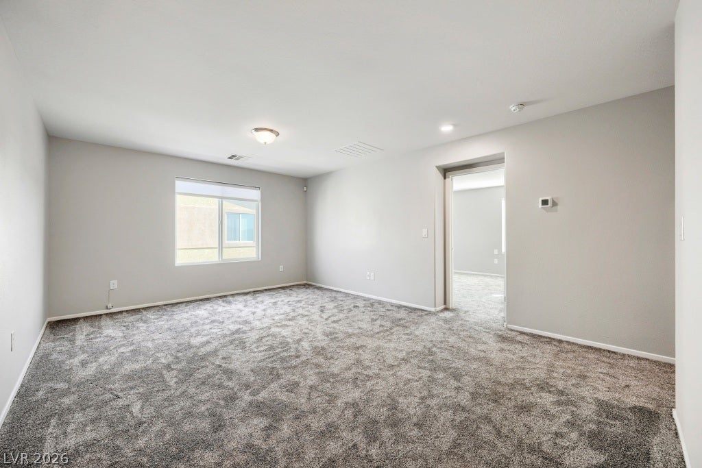 7241 Glistening Star Street, North Las Vegas, NV 89084 Plush wall-to-wall carpeting and clean neutral walls anchor this versatile upstairs loft area.