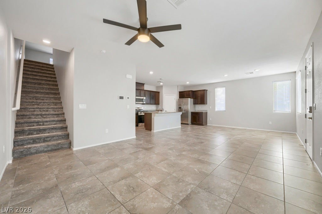 7241 Glistening Star Street, North Las Vegas, NV 89084 An open main floor features durable tile flooring and leads directly to the kitchen.
