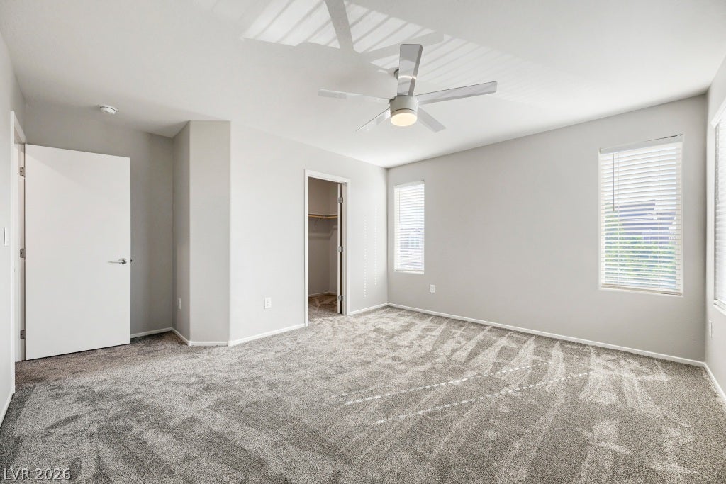 7241 Glistening Star Street, North Las Vegas, NV 89084 Generous window openings and plush carpeting define this serene bedroom space.