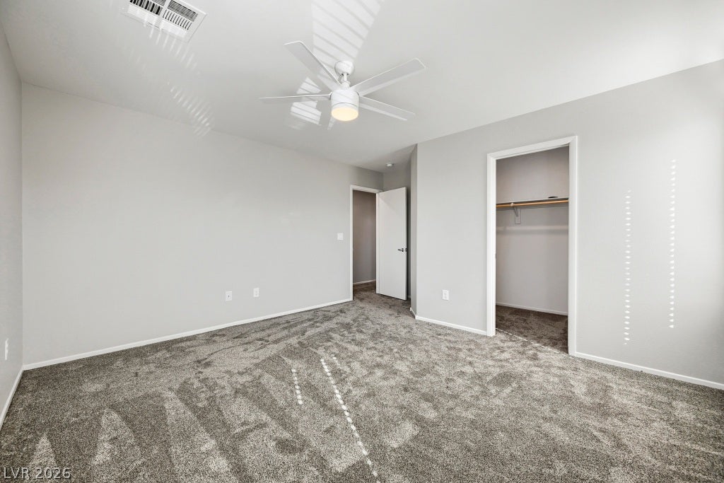 7241 Glistening Star Street, North Las Vegas, NV 89084 Soft carpeting pairs with clean-lined walls under high ceilings in this tranquil bedroom retreat.