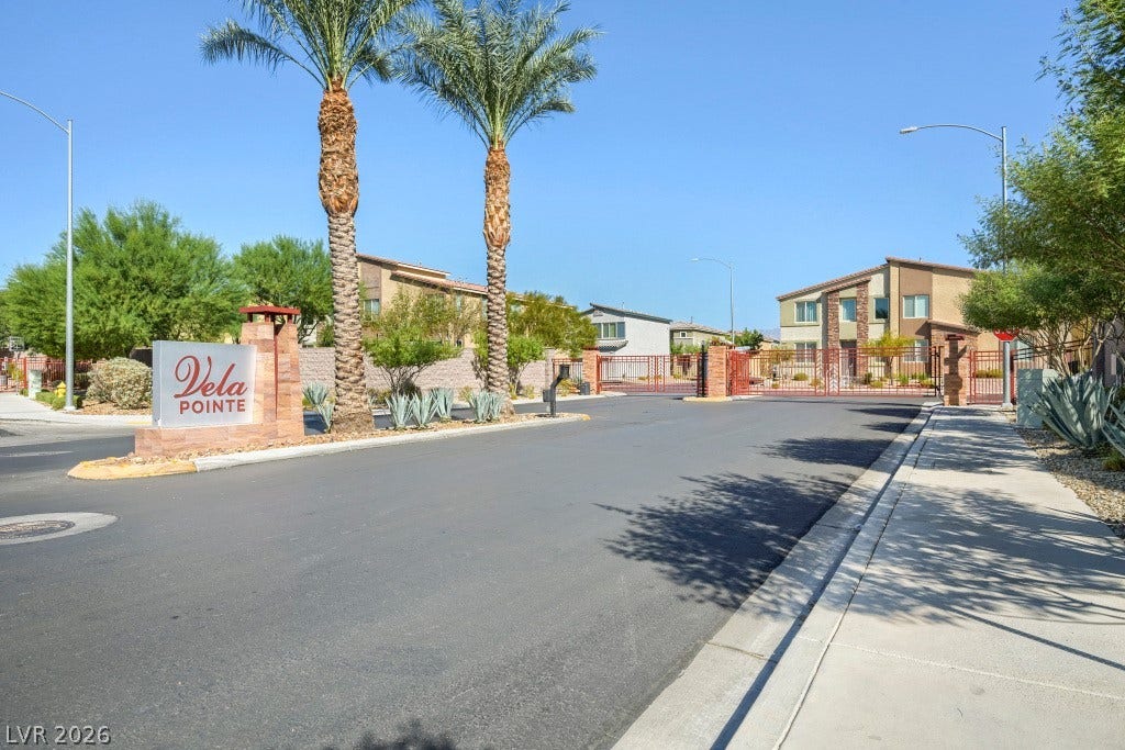7241 Glistening Star Street, North Las Vegas, NV 89084 Palm trees frame the gated entrance to this modern neighborhood of multi-level homes.