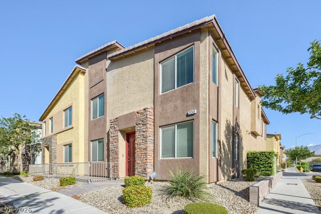 7241 Glistening Star Street, North Las Vegas, NV 89084 Multi-textured stucco and stone accents define this modern exterior under clear blue skies.