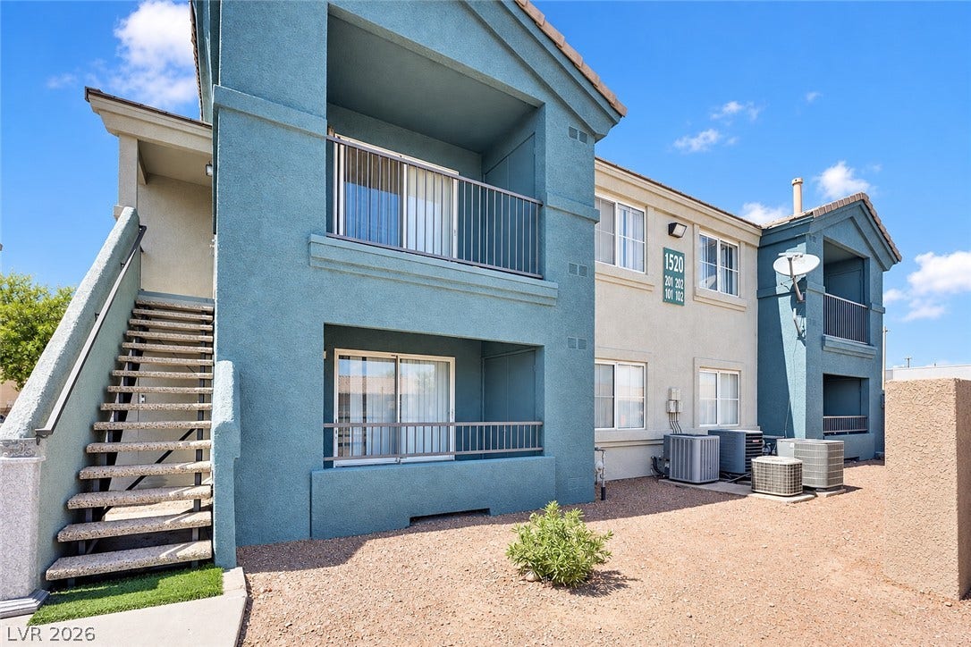 1520 Frank Aved Street, #201, Las Vegas, NV 89110 Stucco exteriors and covered balconies define the architectural profile of this multi-level residential building.