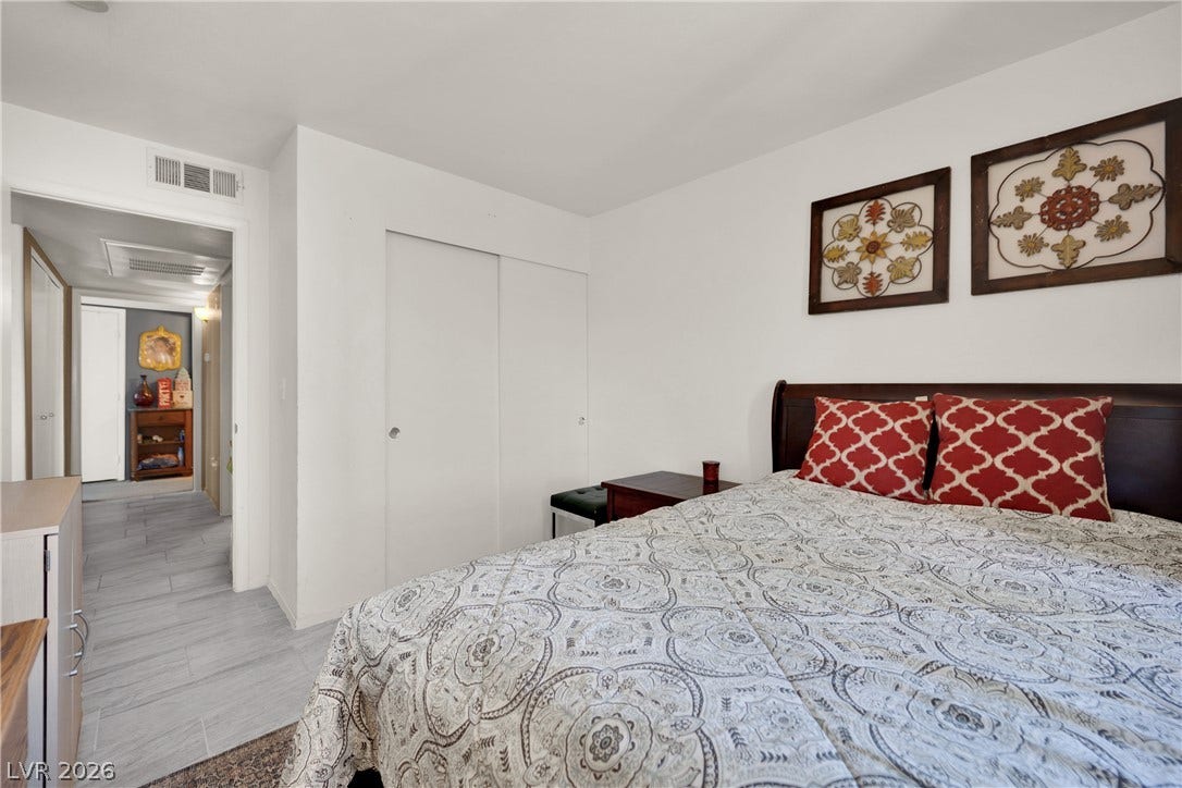 1520 Frank Aved Street, #201, Las Vegas, NV 89110 Smooth wood floors flow seamlessly from this restful retreat into the adjacent hallway.
