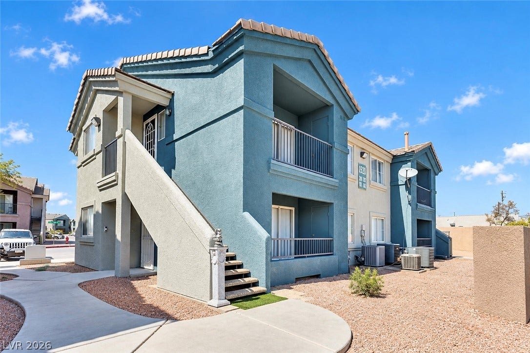 1520 Frank Aved Street, #201, Las Vegas, NV 89110 Stucco exterior and concrete walkways define this modern multi-level residential building design.