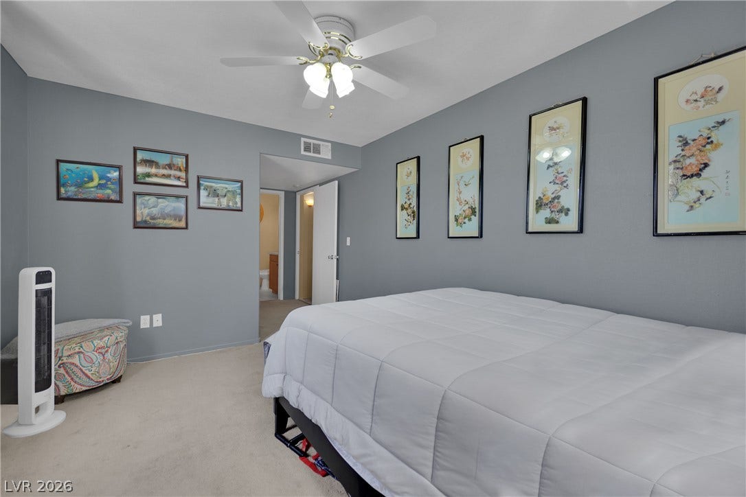1520 Frank Aved Street, #201, Las Vegas, NV 89110 Plush carpeting anchors this quiet bedroom retreat with views into the adjoining hall.