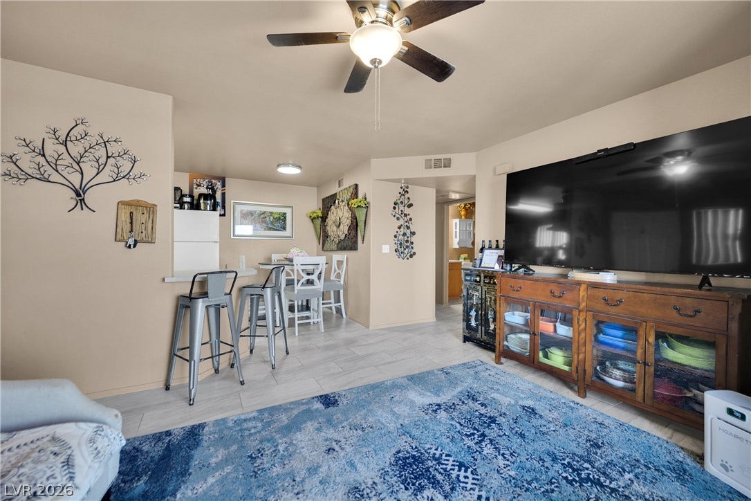 1520 Frank Aved Street, #201, Las Vegas, NV 89110 Tile flooring runs throughout this open layout connecting the main living area and dining space.