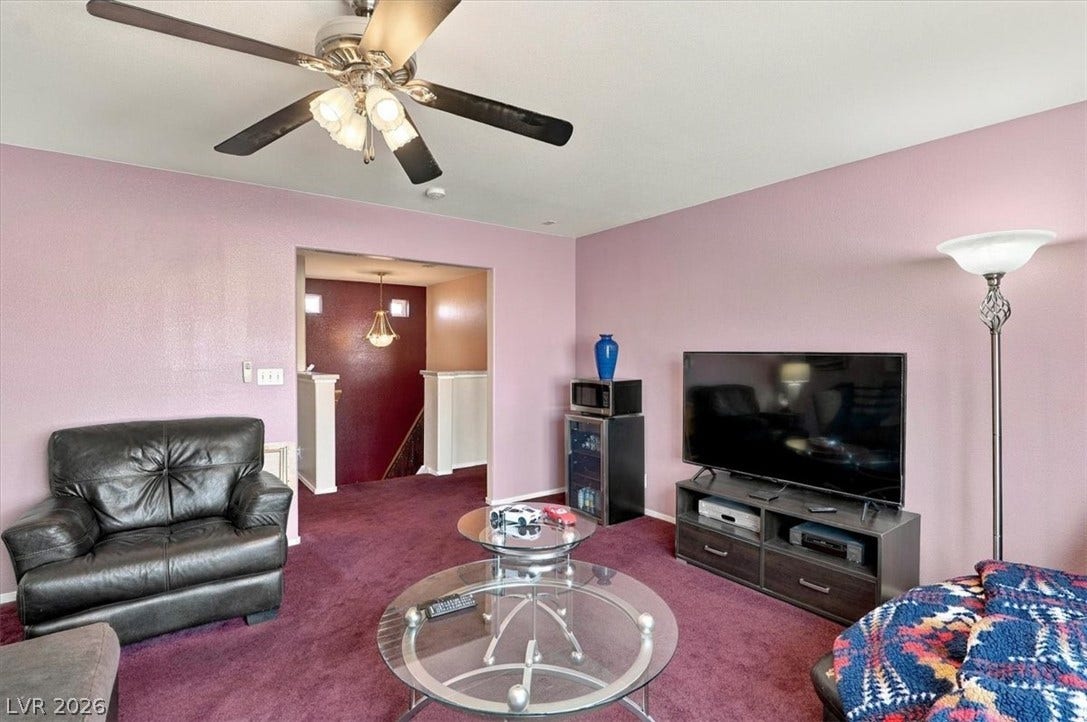 6329 Snow Cactus Street, North Las Vegas, NV 89031 An open doorway connects the cozy living area to the adjacent entry hall.