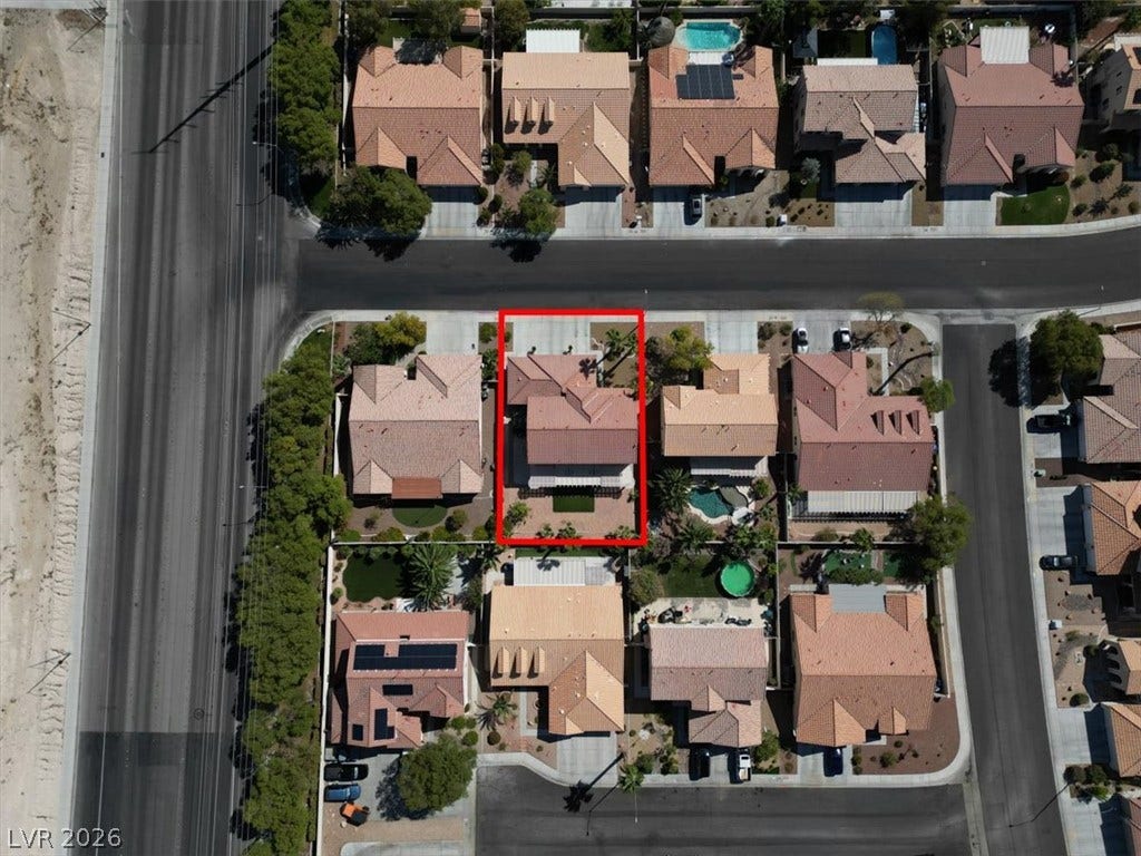 6329 Snow Cactus Street, North Las Vegas, NV 89031 An aerial perspective showcases the home's structured lot within a quiet suburban neighborhood.