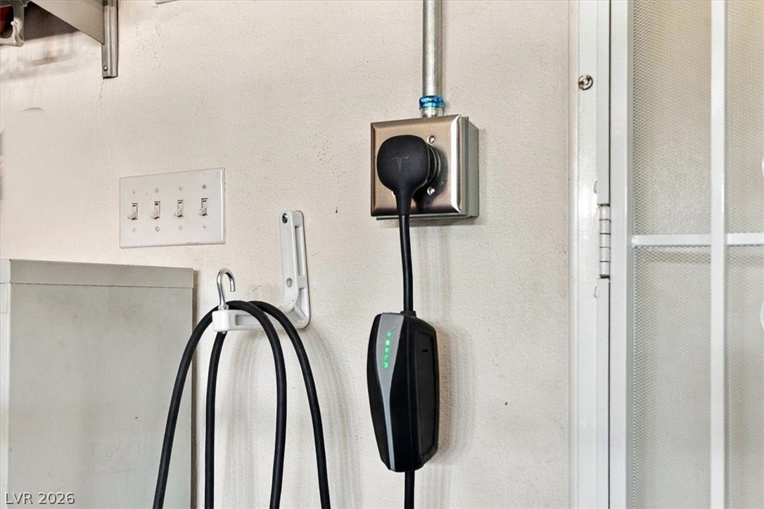 6329 Snow Cactus Street, North Las Vegas, NV 89031 An electric vehicle charging station adds modern convenience to the home.