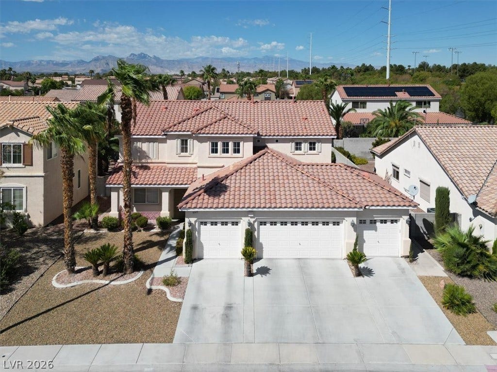 6329 Snow Cactus Street, North Las Vegas, NV 89031 Spanish tile roofing and a spacious three-car garage define this handsome two-story residence.