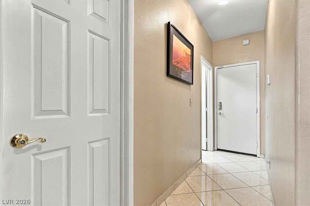 6329 Snow Cactus Street, North Las Vegas, NV 89031 Polished tile flooring guides guests through this welcoming entry hall.