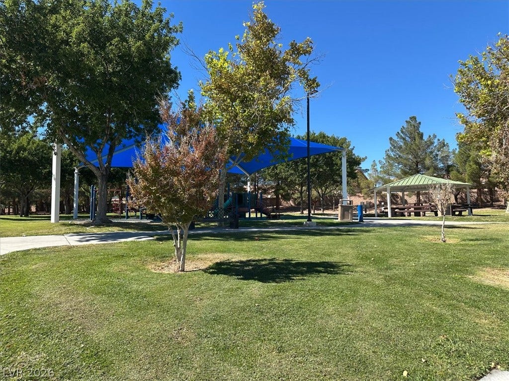 6329 Snow Cactus Street, North Las Vegas, NV 89031 Mature trees shade the manicured lawns surrounding a covered pavilion and recreation areas.