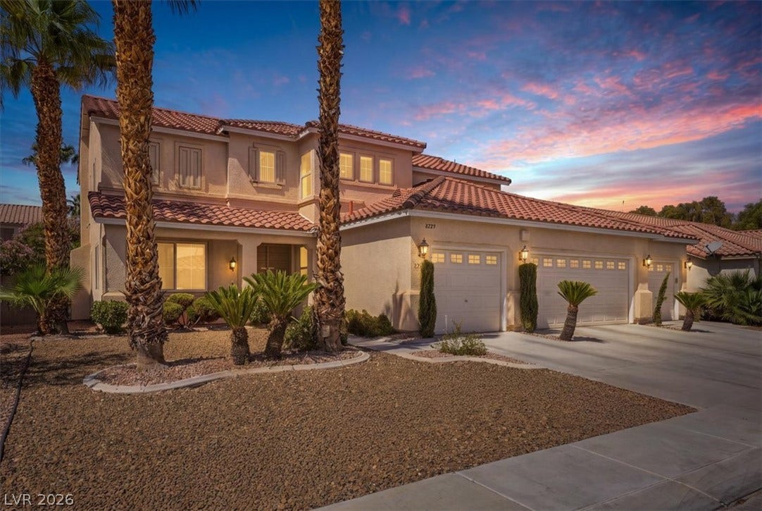 6329 Snow Cactus Street, North Las Vegas, NV 89031 Elegant Spanish tile roofs and manicured desert landscaping define this multi-level facade.