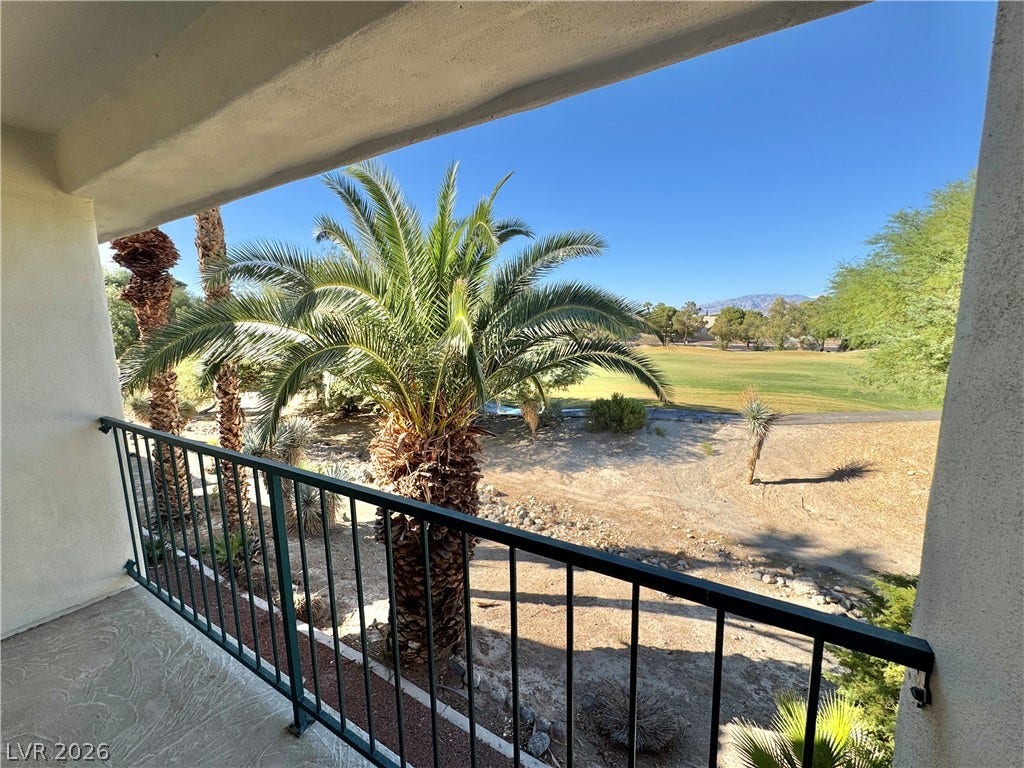 Sweeping golf course views stretch beyond this private covered balcony.