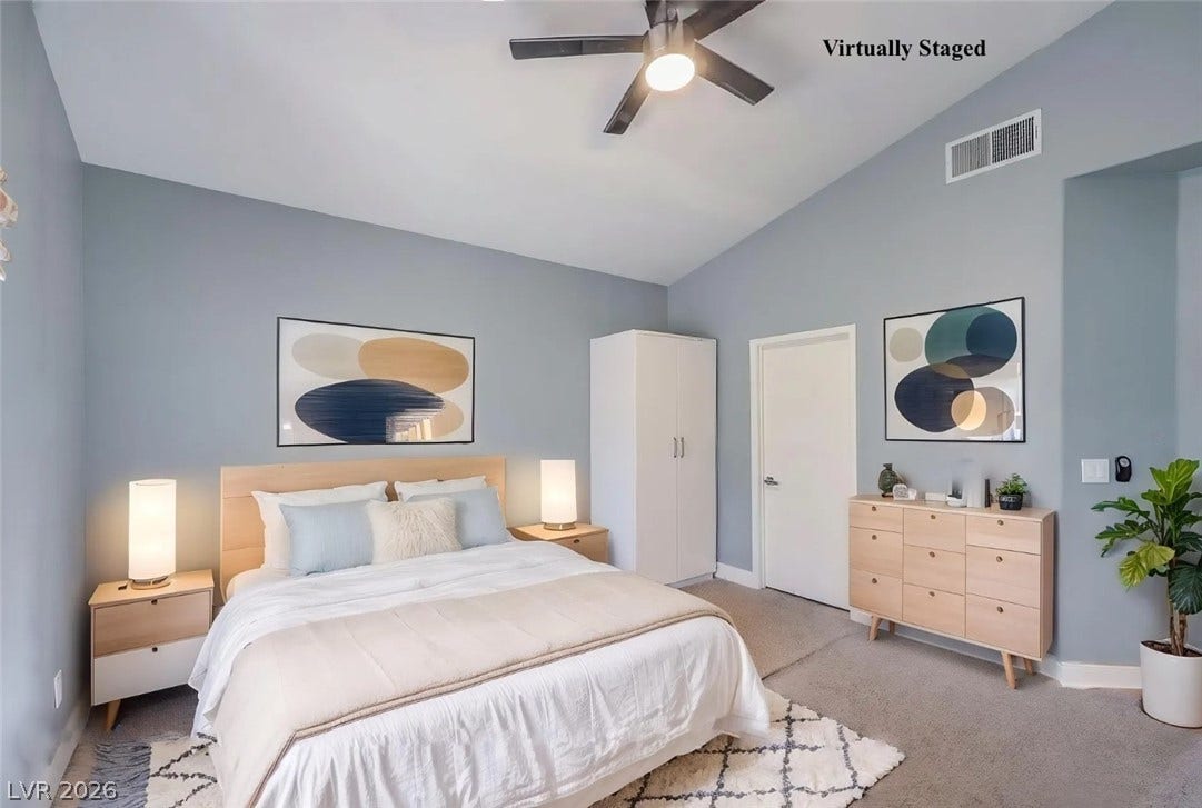 2421 Sunrise Springs Court, North Las Vegas, NV 89031 Slanted ceilings and soft carpeting create a tranquil atmosphere in this serene sleeping space.