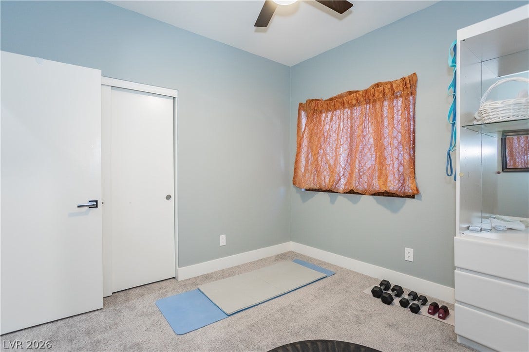 2421 Sunrise Springs Court, North Las Vegas, NV 89031 Plush carpeting and smooth walls define this versatile additional bedroom space.