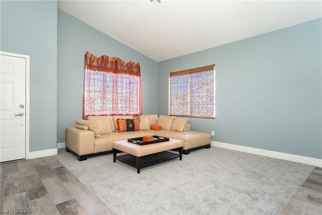 2421 Sunrise Springs Court, North Las Vegas, NV 89031 High vaulted ceilings and dual flooring textures define this comfortable living area.