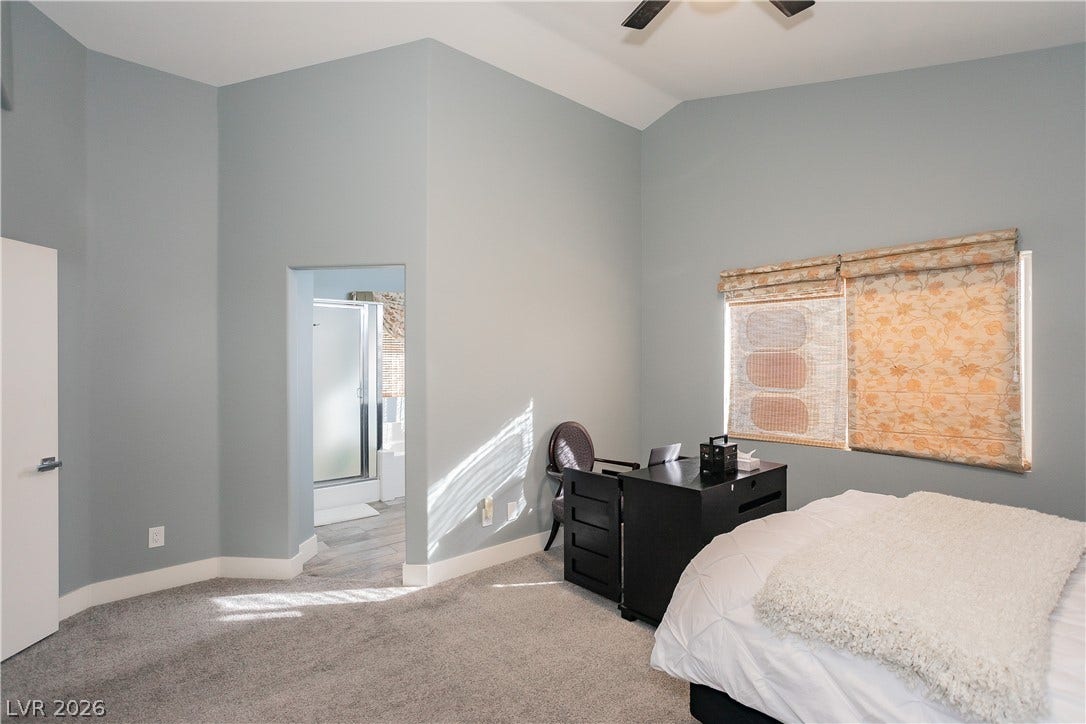 2421 Sunrise Springs Court, North Las Vegas, NV 89031 High vaulted ceilings and soft carpet floorings define this comfortable private retreat.