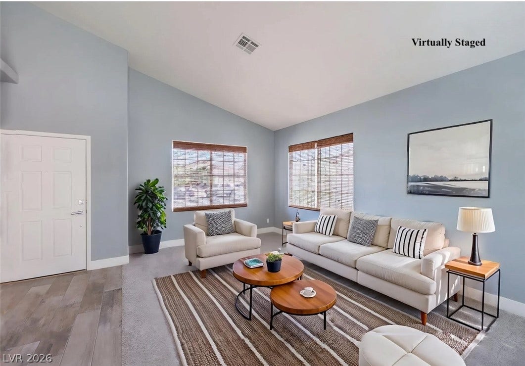 2421 Sunrise Springs Court, North Las Vegas, NV 89031 Vaulted ceilings soar over a welcoming space anchored by clean architectural lines and dual windows.