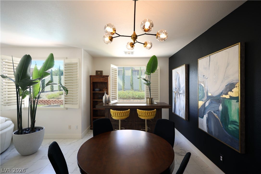3018 Via Sarafina Drive, Henderson, NV 89052 Gleaming tile floors and custom plantation shutters enhance this modern dining area and bar setup.