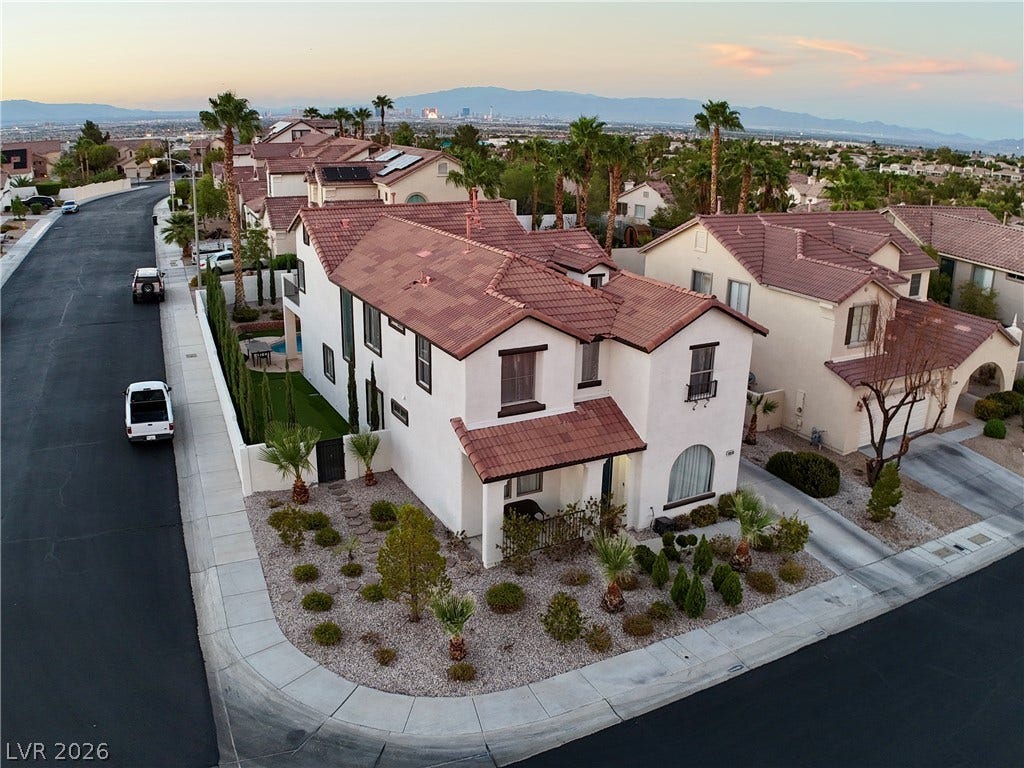3018 Via Sarafina Drive, Henderson, NV 89052 A prominent corner location highlights this desert home with tile roofing and meticulous gravel landscaping.