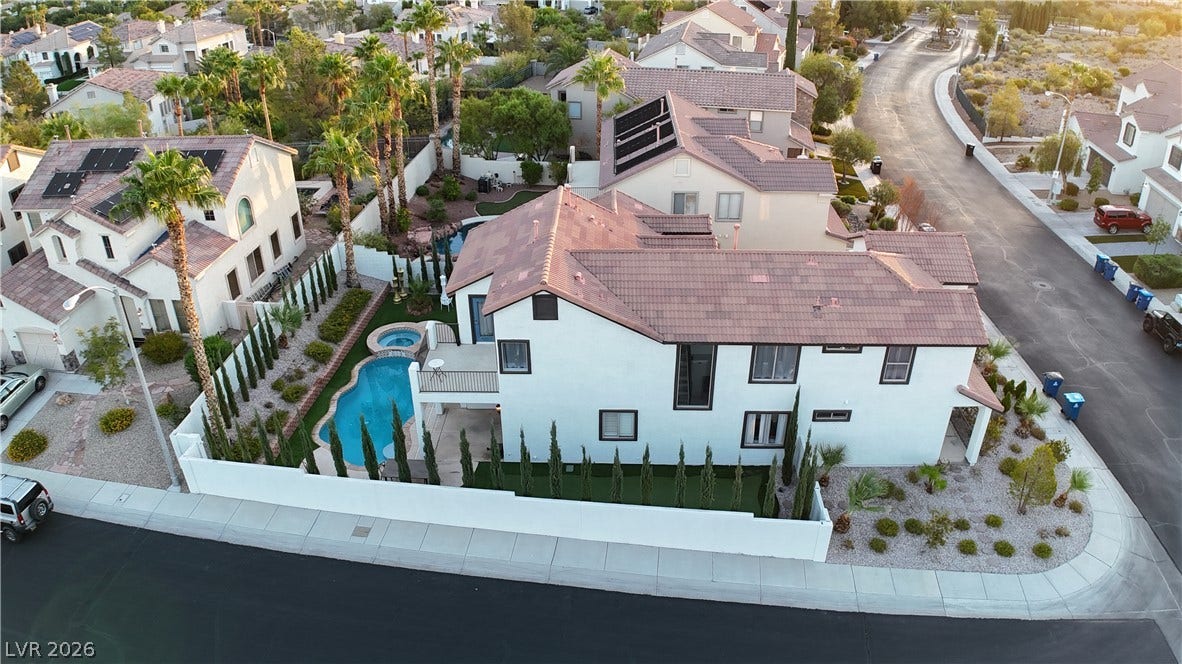 3018 Via Sarafina Drive, Henderson, NV 89052 An aerial perspective reveals a modern multi-level residence boasting a private pool and manicured yard.