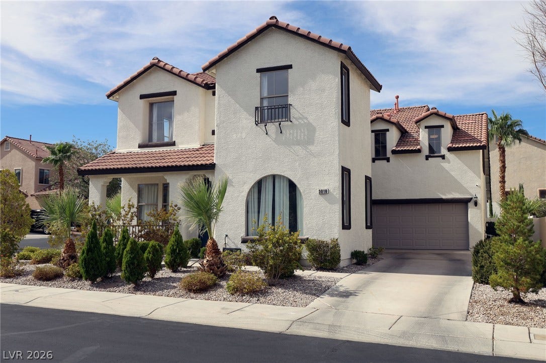 3018 Via Sarafina Drive, Henderson, NV 89052 Spanish tile roofing and classic stucco exterior define this beautiful multi-level residence.