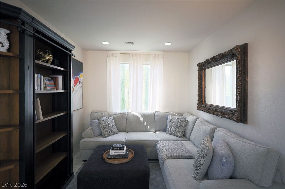 3018 Via Sarafina Drive, Henderson, NV 89052 Smooth plaster walls and recessed lighting define this inviting, cozy living area.
