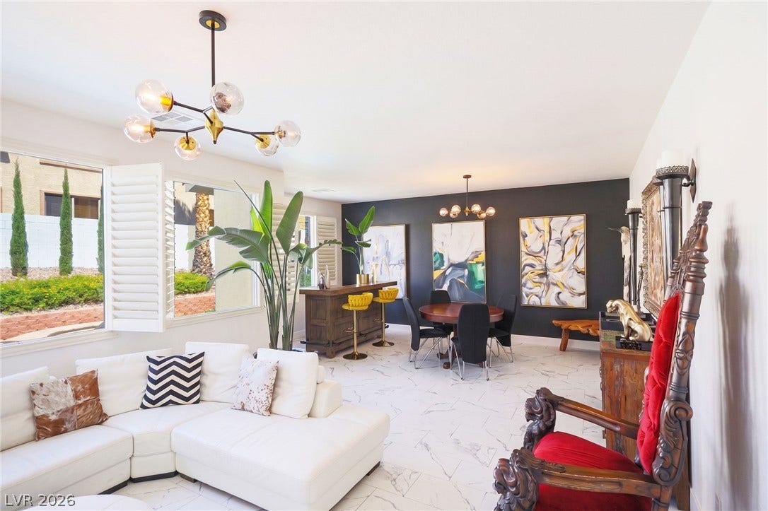 3018 Via Sarafina Drive, Henderson, NV 89052 Polished tile flooring and an open-concept layout define this light-filled main living space.