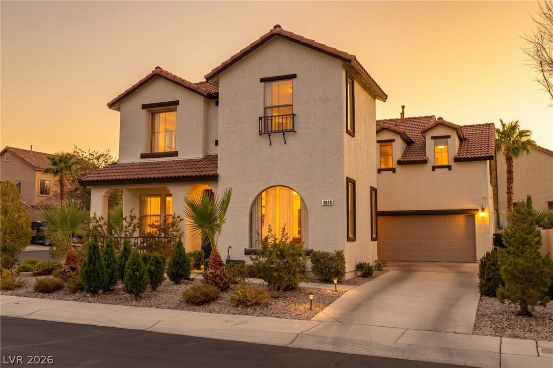 3018 Via Sarafina Drive, Henderson, NV 89052 Spanish tile roofing and stucco exterior detailing define this two-story residential facade.