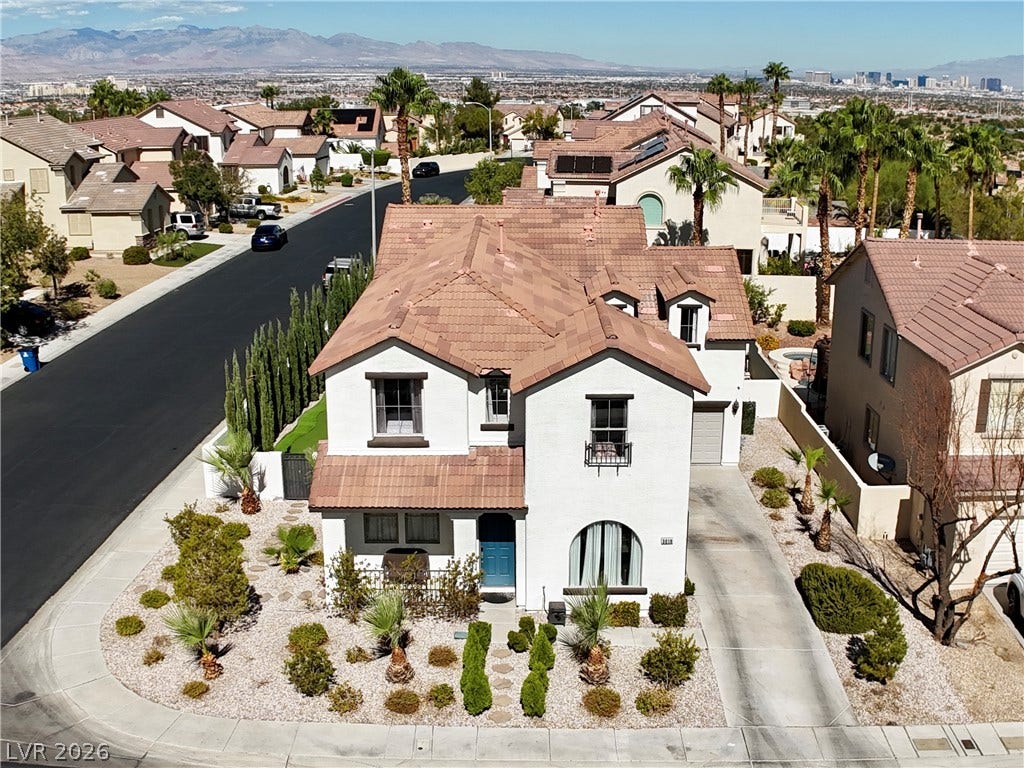 3018 Via Sarafina Drive, Henderson, NV 89052 Nestled on a corner lot, this two-story home overlooks a quiet suburban neighborhood.