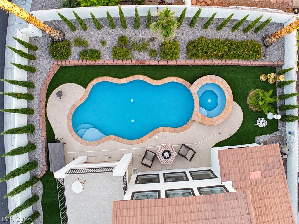 3018 Via Sarafina Drive, Henderson, NV 89052 An aerial perspective showcases a custom pool and integrated spa within a manicured backyard setting.