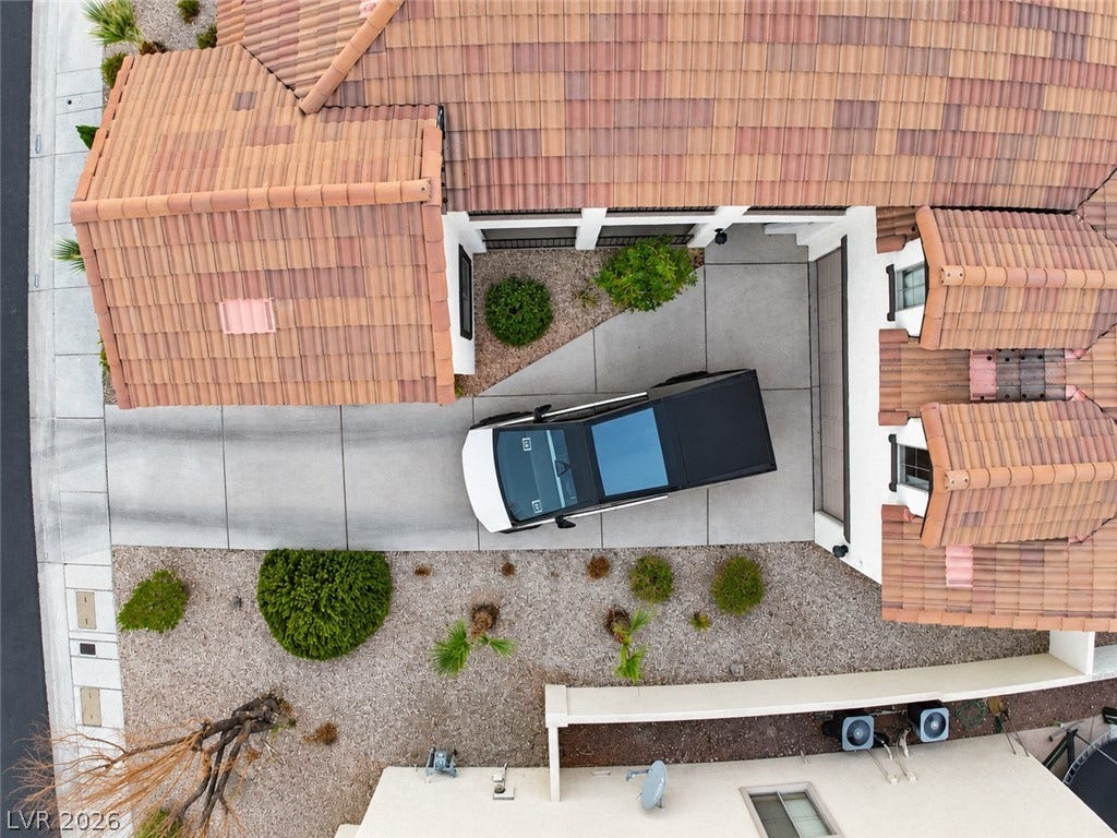 3018 Via Sarafina Drive, Henderson, NV 89052 A spacious driveway and structured tiling highlight the exterior of this modern residence.