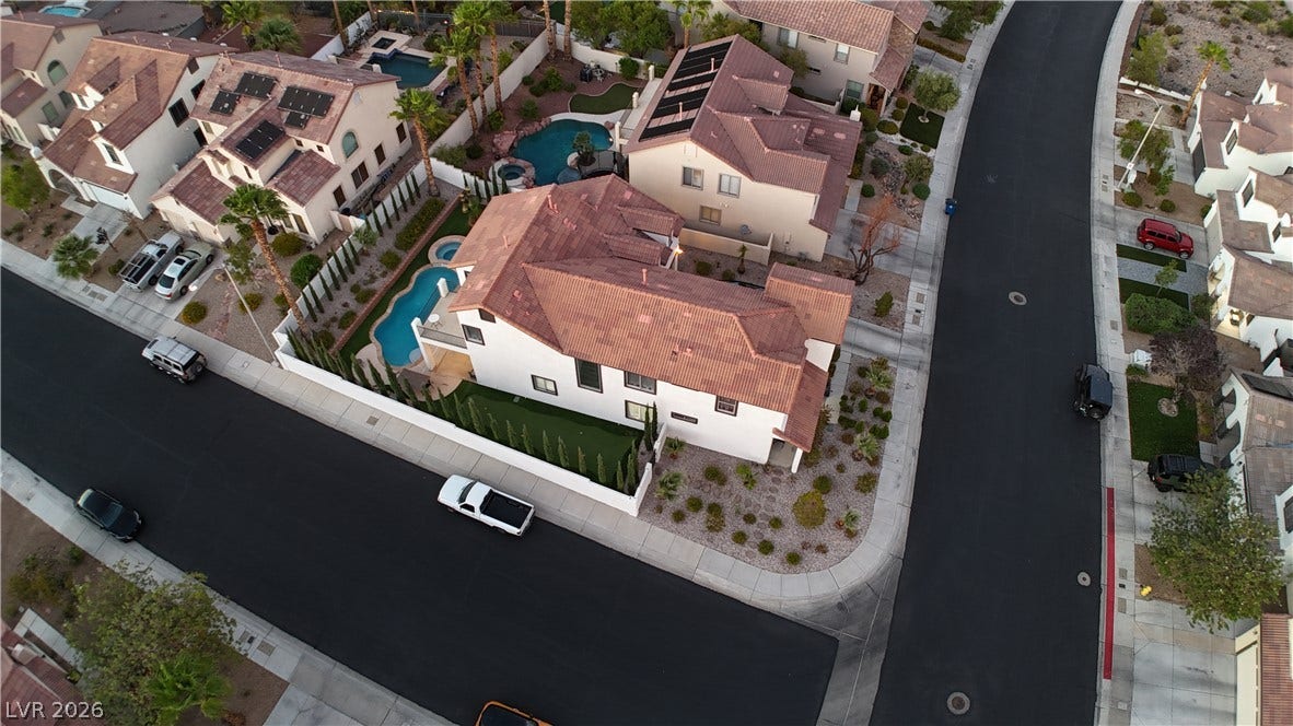 3018 Via Sarafina Drive, Henderson, NV 89052 An aerial perspective showcases the classic tile roofing and structured suburban neighborhood design.