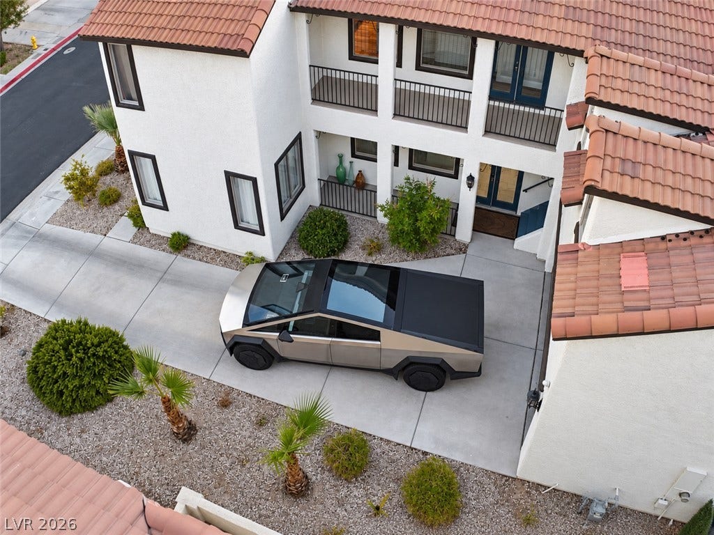 3018 Via Sarafina Drive, Henderson, NV 89052 A spacious concrete driveway leads to this multi-level home with a Spanish tile roof.