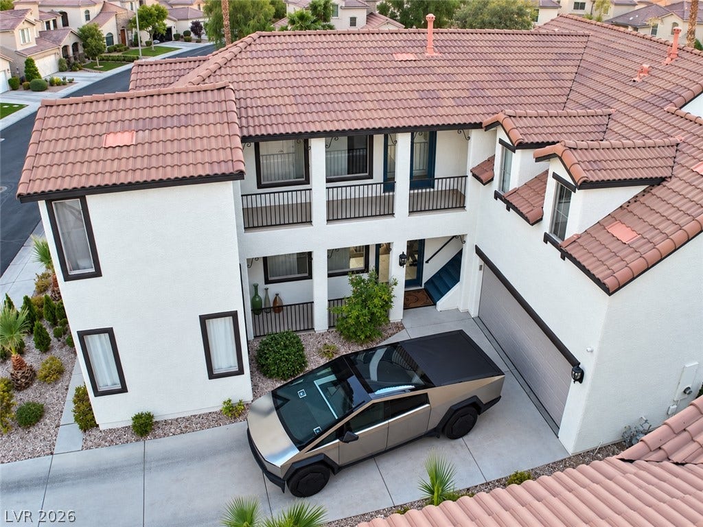 3018 Via Sarafina Drive, Henderson, NV 89052 Spanish tile roofing and pristine stucco walls define this multi-level home exterior.