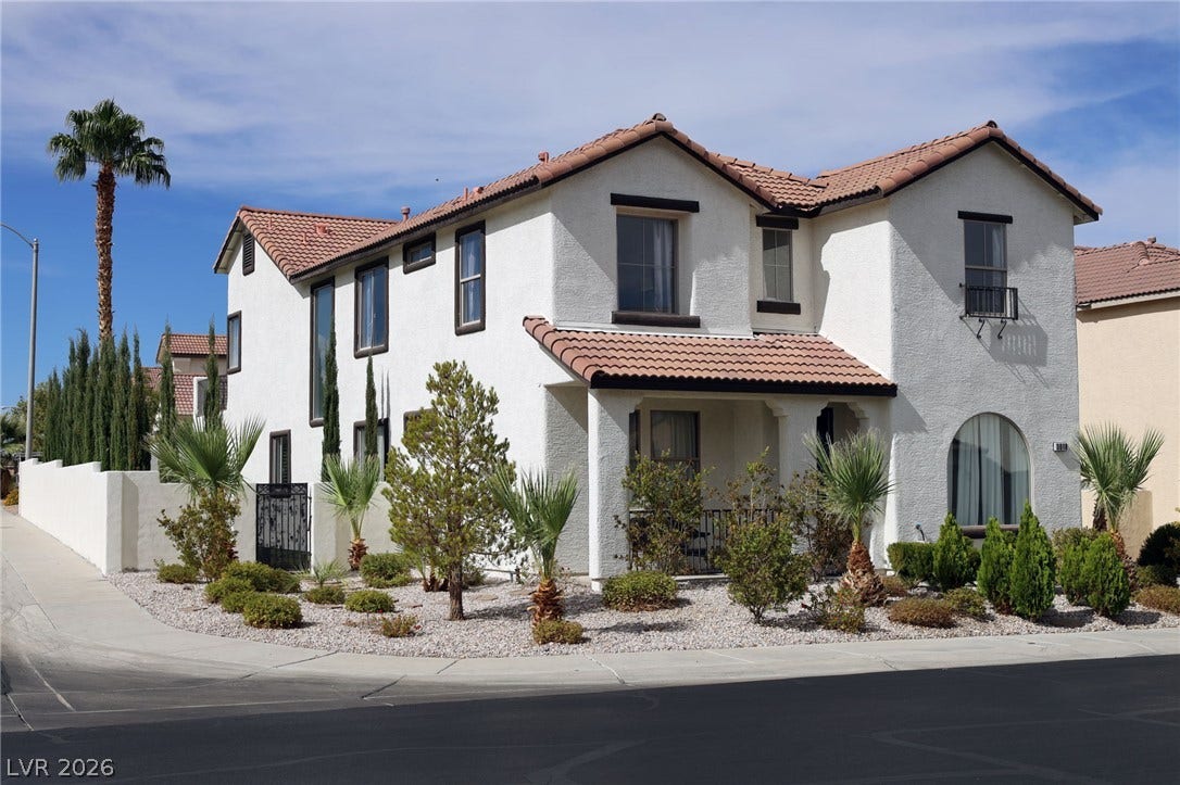 3018 Via Sarafina Drive, Henderson, NV 89052 Stucco walls and a classic tile roof highlight this elegant multi-level corner property.