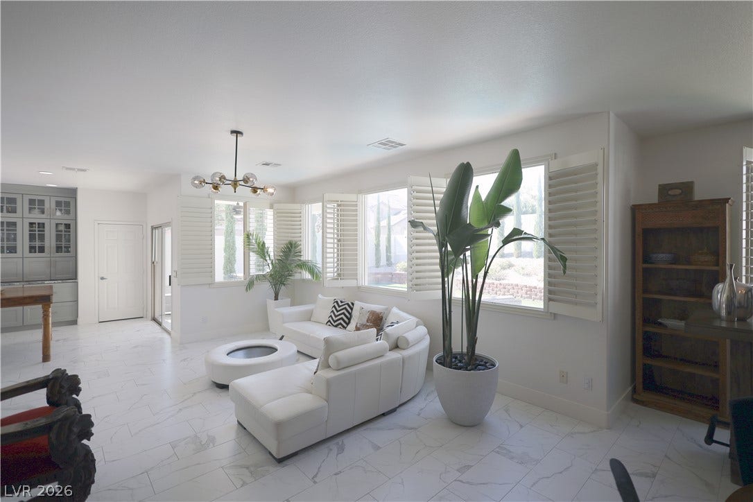 3018 Via Sarafina Drive, Henderson, NV 89052 Polished tile floors and plantation shutters define this open, airy living space.