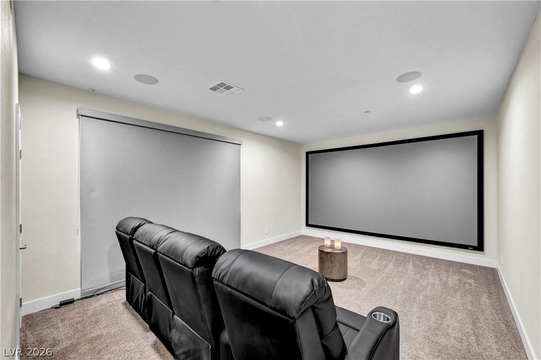 4709 Amazing View Street, Las Vegas, NV 89129 Recessed lighting and soft carpeting create a cozy atmosphere in this private home theater.
